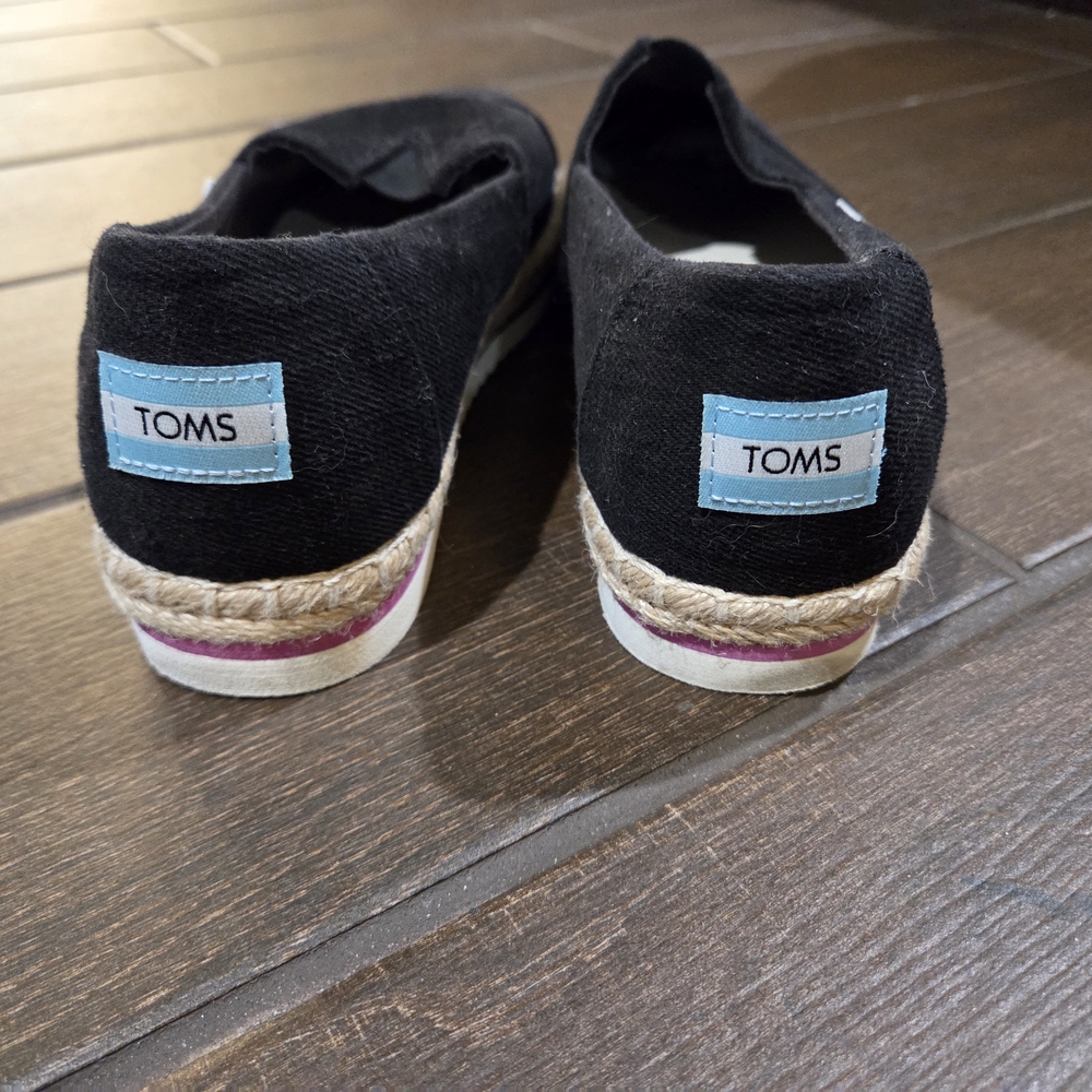 TOMS Black Canvas Slip-Ons with Pink Accent